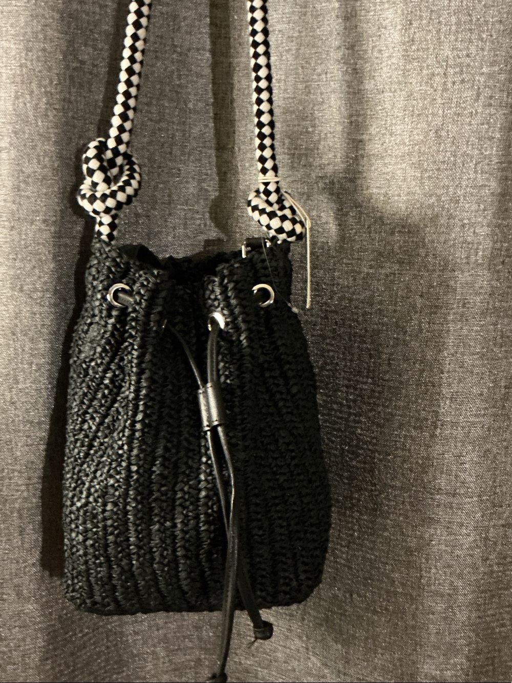 Black Woven Drawstring Crossbody Bag with Patterned Strap